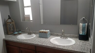 Dual vanity master bath with Granite matching kitc
