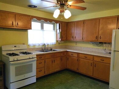 Kitchen  13 x 11  Birch cabinets, gas stove, refri