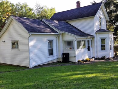 Rear view of house.  Enclosed side porch.