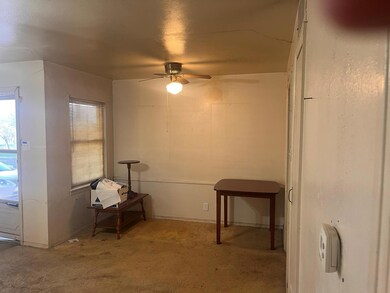 Misc room featuring ceiling fan and light carpet