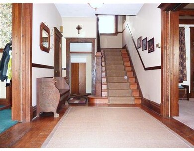 Entry/Foyer. Original wood work with glass pocket 