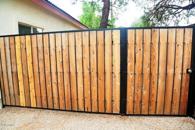 Front Wrought Iron and Wood Fence