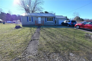 Ranch-style home featuring a front yard