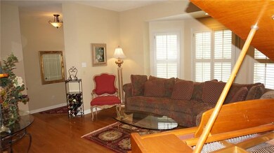 Living Room - Hardwood flooring, bay window.