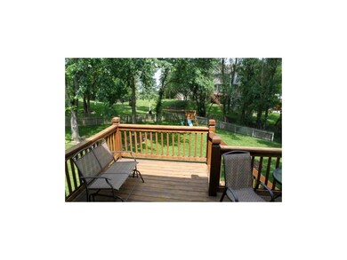 Deck overlooking treed back yard