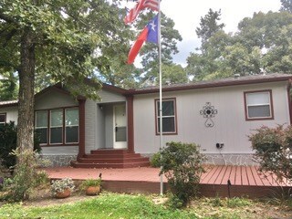 Large decked front porch, freshly painted. Great place to sit in the afternoon shade 

