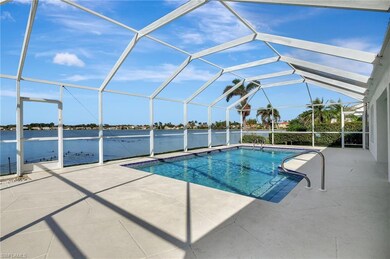 View of swimming pool with a water view, a patio a