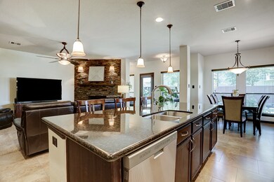 Sleek stainless steel appliances and fixtures give a modernized feel