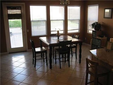 Open dining area adjoining kitchen.