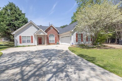 View of front of home featuring concrete driveway,