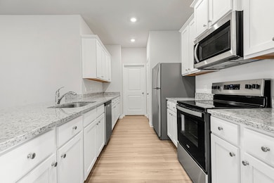 Whirlpool kitchen appliances and granite counterto