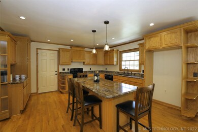 Extra shelving beside refrigerator for display or