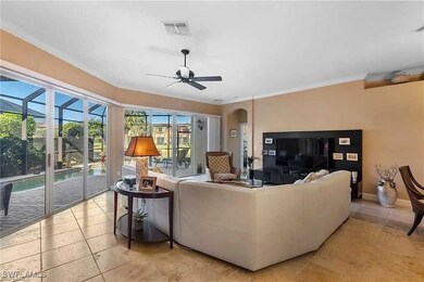 Living area featuring baseboards, visible vents, o