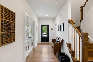 Entrance foyer with hardwood / wood-style flooring