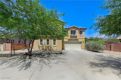 View of front of property with a garage, stucco si