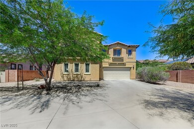 View of front of property with a garage, stucco si