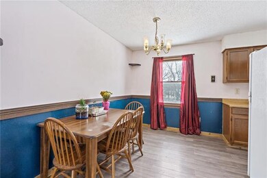 Eat-in kitchen with luxury vinyl plank floors