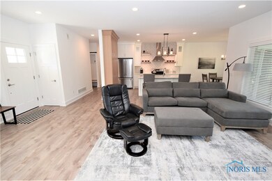 Luxury vinyl plank flooring flows throughout most
