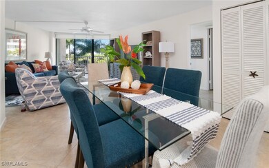 Dining space with light tile patterned floors and ceiling fan