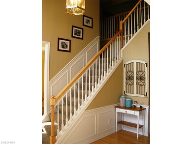 Enter through the two story foyer with hardwood fl