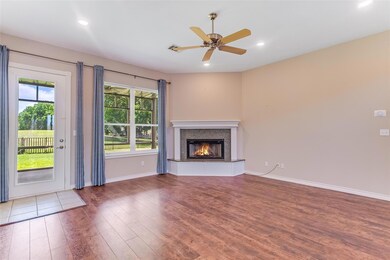 Unfurnished living room with wood finished floors
