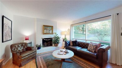 Living room looking with wood burning fireplace
