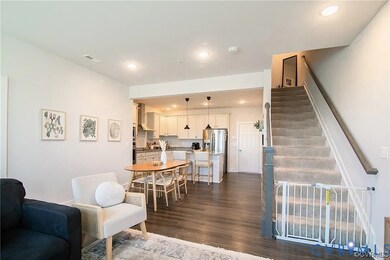 Dining room featuring recessed lighting, dark wood finished floors, and stairs