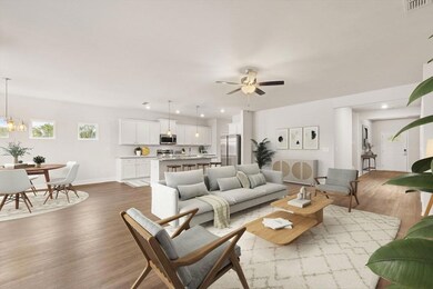 Living room with wood finished floors, ceiling fan, recessed lighting, and baseboards