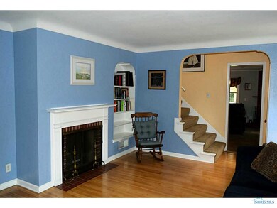Living Room. One wood burning fireplace is in the 