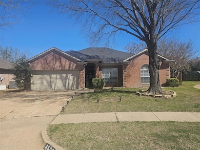 Ranch-style home with brick siding, a front lawn, 
