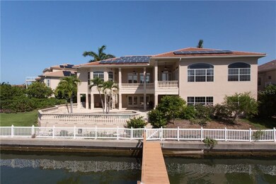 Rear elevation of the home with solar panels that 
