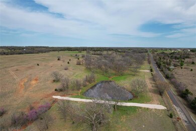 Birds eye view of property with a rural view