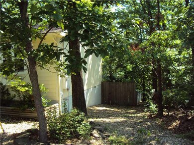 Exterior Back/Side. Side looking toward Front privacy fence