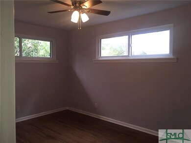 One of three bedrooms good wall space with nice na