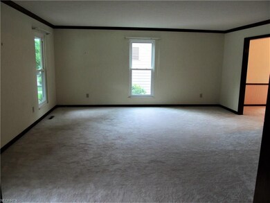 Large Living Room to the left of the Foyer measure