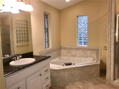 Master bath has a garden tub, His & Her vanities,