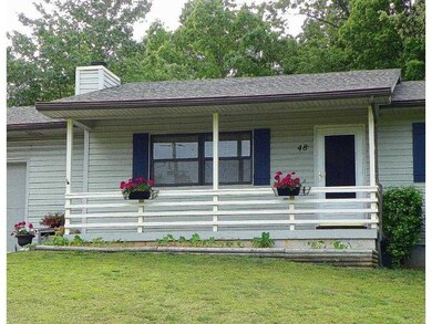Exterior Front. Enjoy the scenery from your covered porch and stay dry if you run into the house in the rain!
