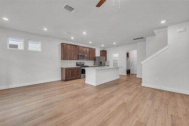 Kitchen with stainless steel appliances, a ceilin
