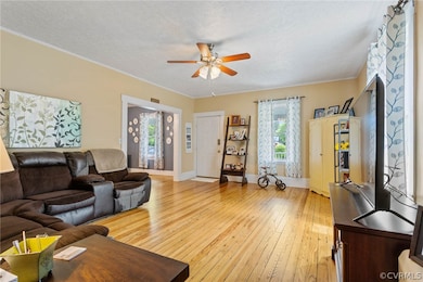Living room with hardwood / wood-style flooring, a
