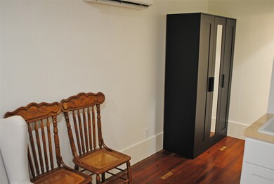 Charming dining chairs and a sleek armoire offer s