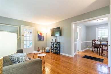 Living Room view into Dining Room & door to Screened Porch