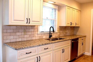 New fixtures and knobs and Backsplash will make yo