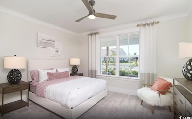 Carpeted bedroom with ornamental molding and a ceiling fan