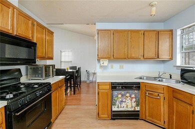Kitchen featuring plenty of natural light, sink, l