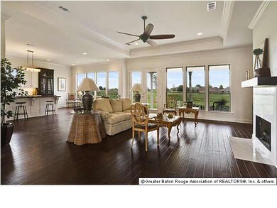 Living area with views of the lake and golf course