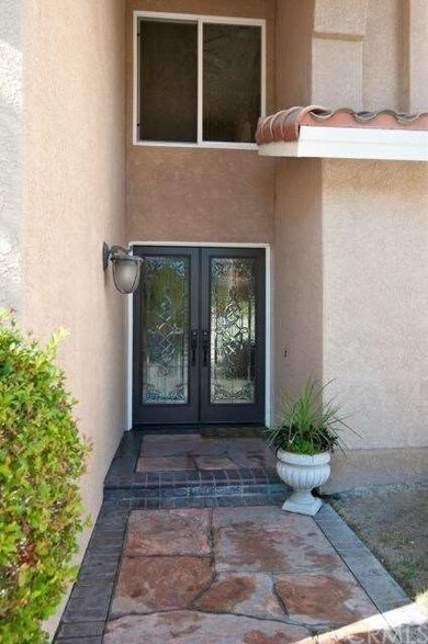 Dual beveled glass doors greet you in this grand e