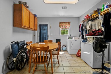 Laundry room with washing machine and clothes drye
