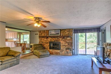 Huge Living Area With Rock Fireplace