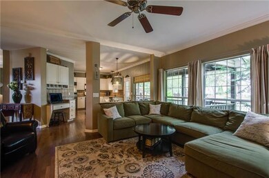 Family room with ceiling fan, all natural light