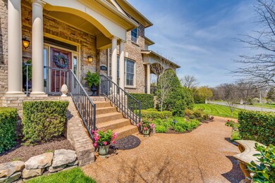 Such a lovely, landscaped walkway as you walk up to the front door of this beautiful home.